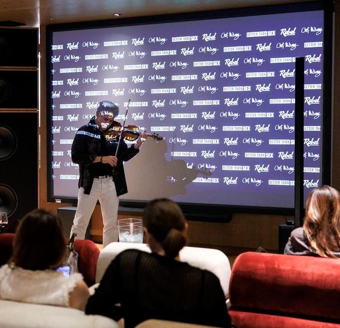 Live violin performance at the Bangkok screening
